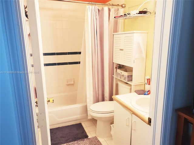 full bathroom featuring shower / tub combo with curtain, vanity, tile patterned floors, and toilet