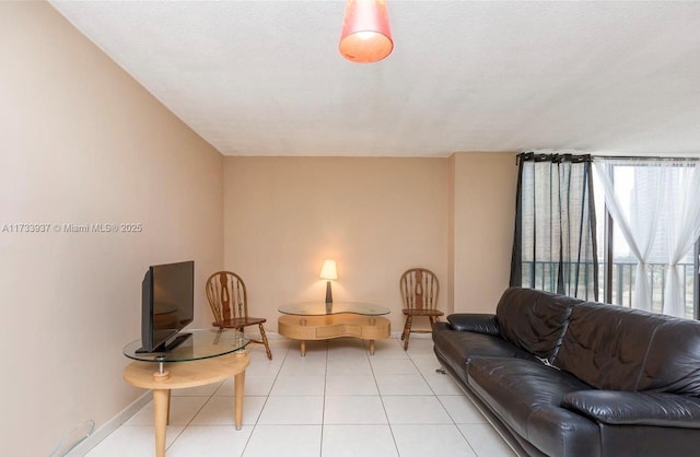 tiled living room featuring a textured ceiling