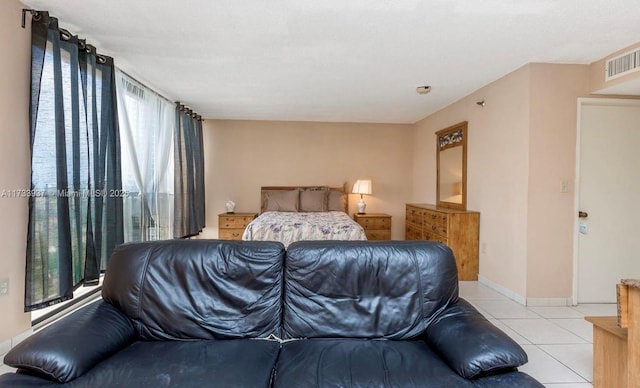 bedroom featuring light tile patterned flooring