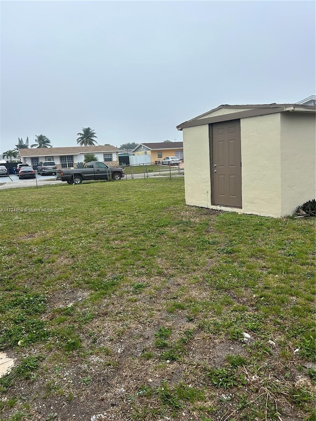 view of yard featuring a storage shed