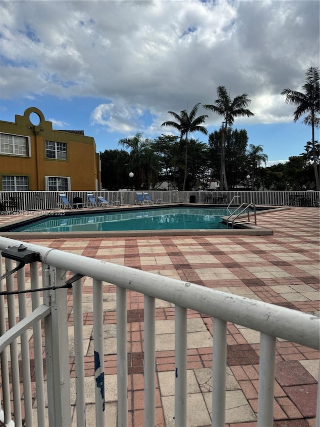 view of pool featuring a patio