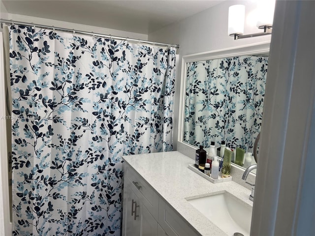 bathroom featuring vanity and walk in shower