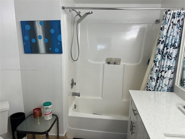 full bathroom featuring vanity, shower / bath combination with curtain, and toilet