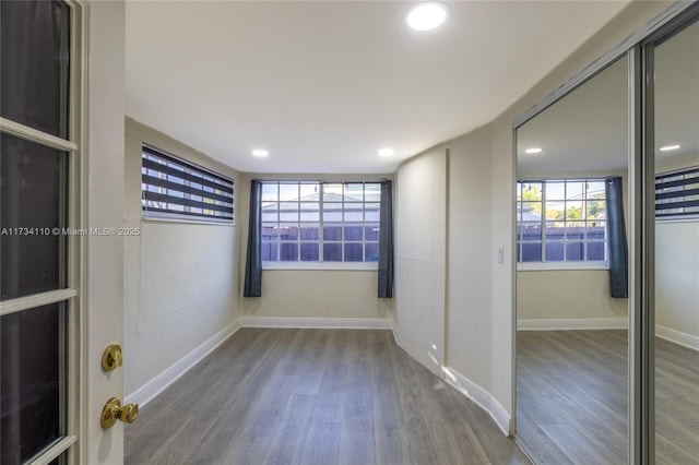 unfurnished room featuring hardwood / wood-style flooring