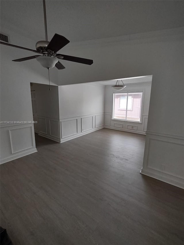 bonus room with dark hardwood / wood-style floors and ceiling fan