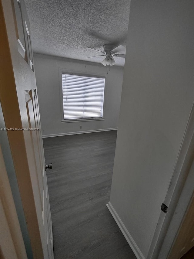 bathroom featuring hardwood / wood-style floors, a textured ceiling, and ceiling fan