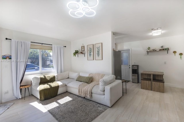 living room with light hardwood / wood-style flooring