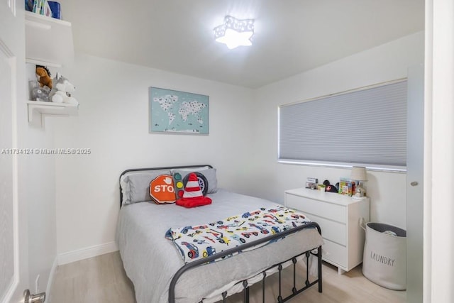 bedroom with light hardwood / wood-style floors