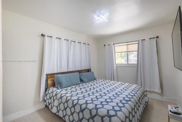 bedroom with light hardwood / wood-style floors