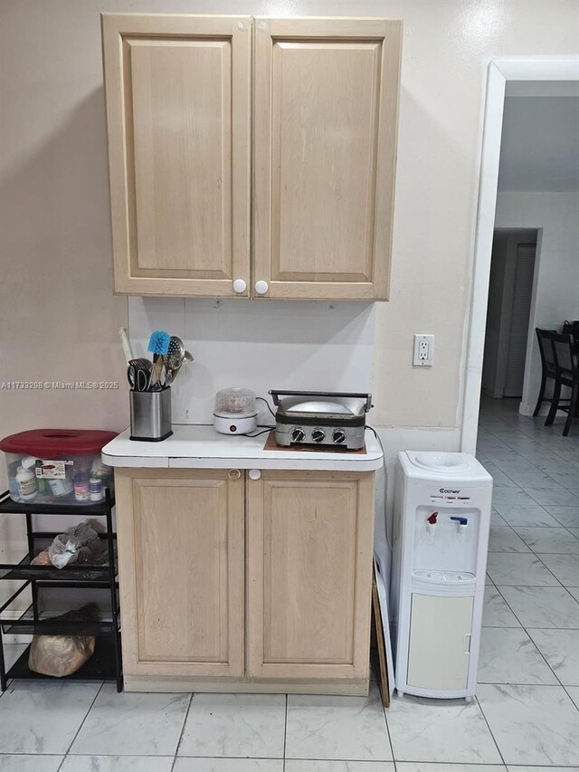 kitchen with light brown cabinetry