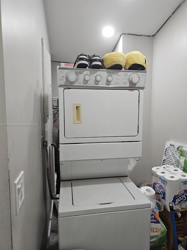 laundry room featuring stacked washing maching and dryer