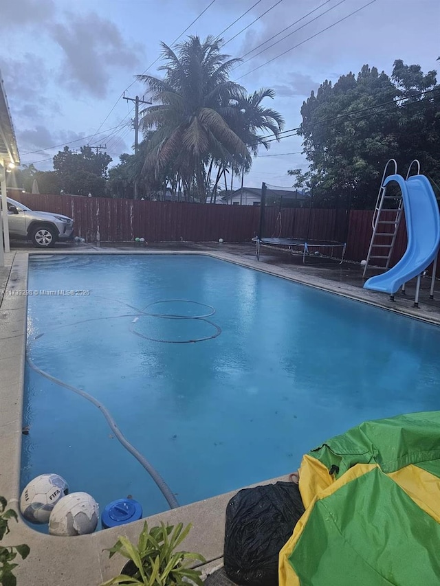 view of pool with a water slide