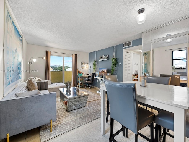 dining room with a textured ceiling