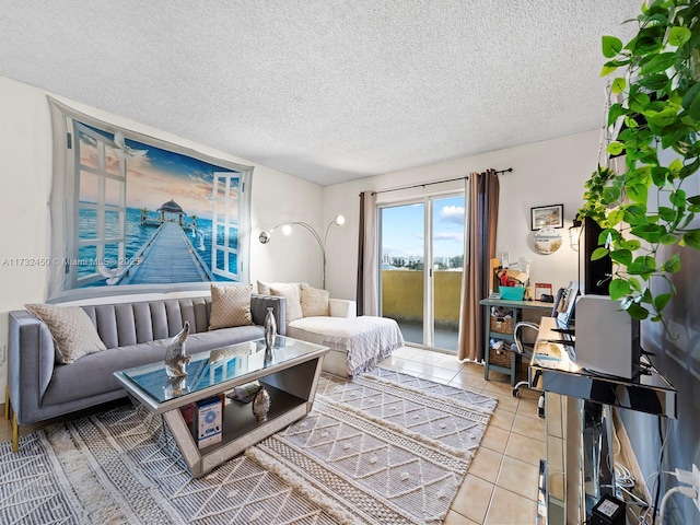 bedroom featuring access to outside, a textured ceiling, and light tile patterned floors