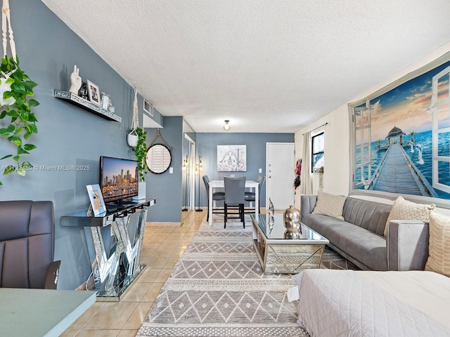 living room with tile patterned flooring and a textured ceiling