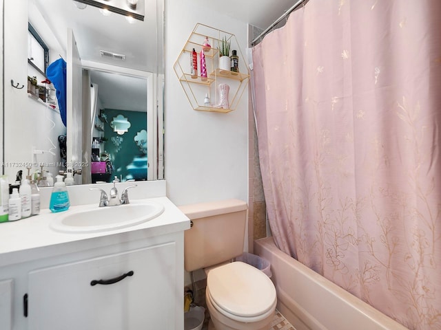 full bathroom featuring vanity, toilet, and shower / tub combo