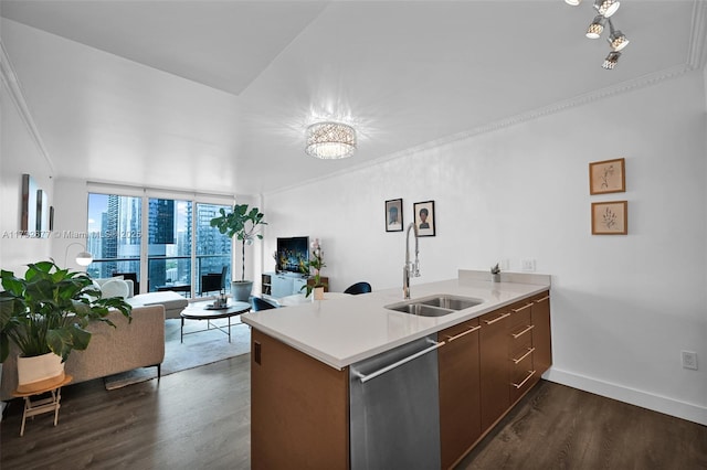 kitchen with dark wood-type flooring, sink, stainless steel dishwasher, ornamental molding, and kitchen peninsula