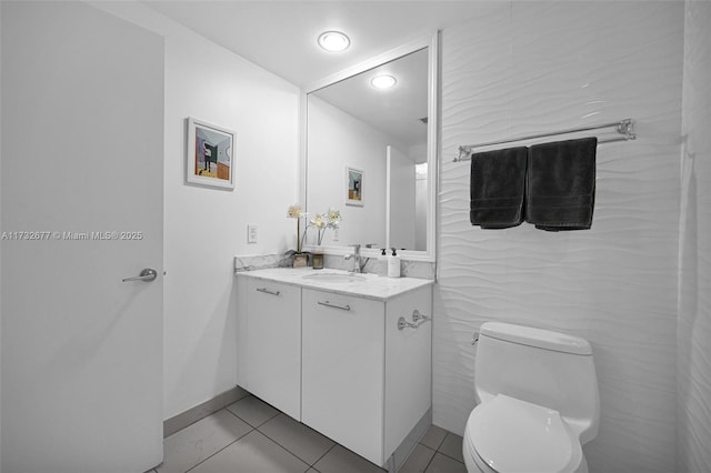 bathroom with vanity, tile patterned floors, and toilet