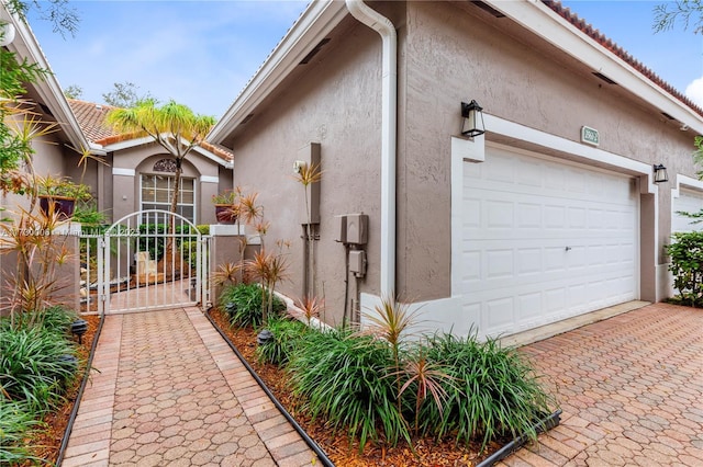 view of side of property with a garage