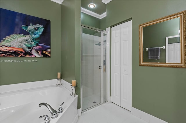 bathroom with crown molding and separate shower and tub