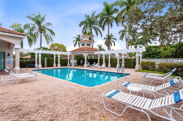 view of swimming pool with a pergola and a patio