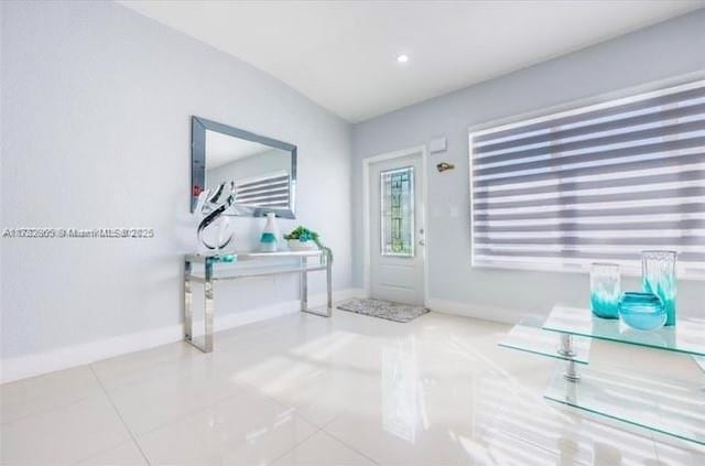 entrance foyer with light tile patterned floors