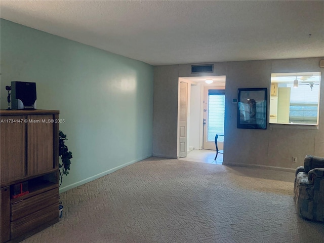 interior space with a textured ceiling