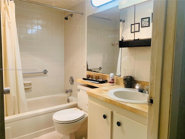 full bathroom with vanity, shower / bath combo, and toilet