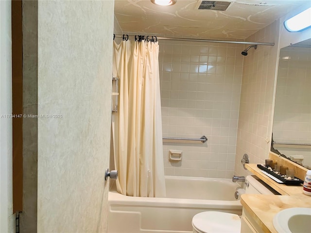 full bathroom with shower / tub combo, vanity, and toilet