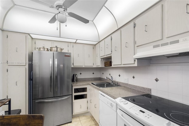 kitchen with white cabinetry, sink, white appliances, and backsplash