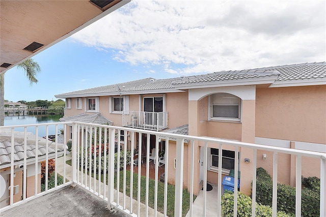 balcony featuring a water view