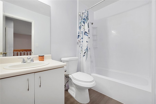 full bathroom with vanity, wood-type flooring, shower / tub combo with curtain, and toilet