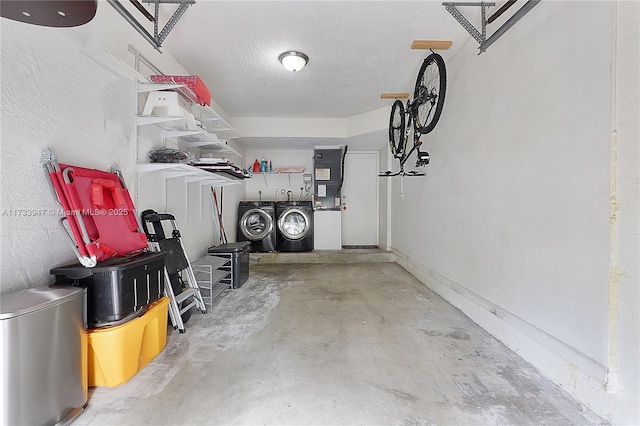 garage featuring washing machine and clothes dryer