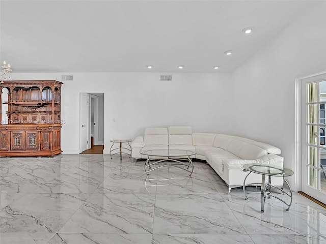 living room with a notable chandelier