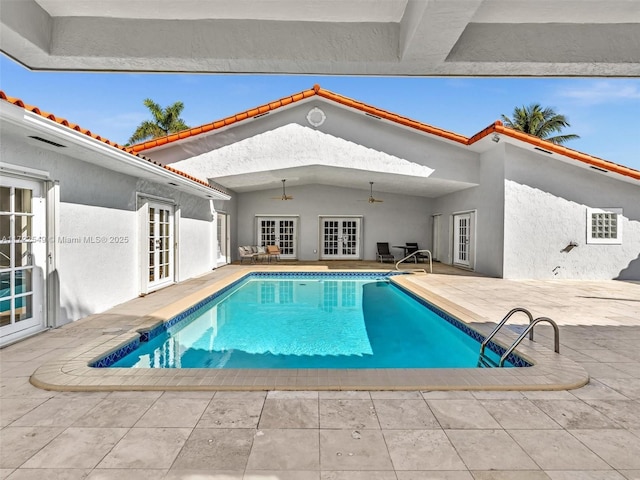 view of swimming pool with a patio area, french doors, and ceiling fan