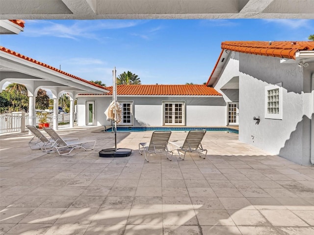12904 Banyan Rd, North Miami, FL 33181 - view of patio / terrace featuring an outdoor pool and french doors