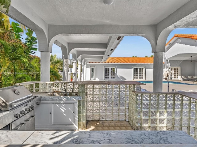 12904 Banyan Rd, North Miami, FL 33181 - view of patio with an outdoor pool and french doors