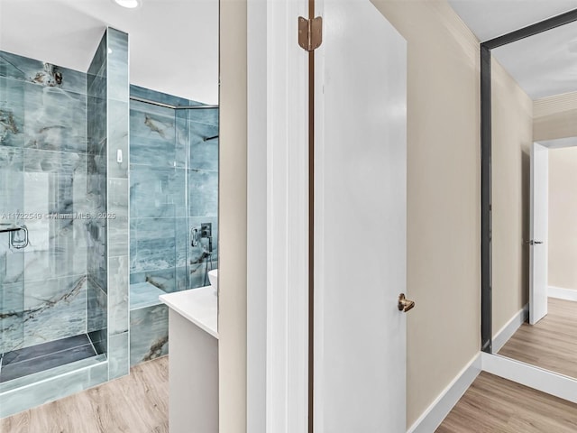 12904 Banyan Rd, North Miami, FL 33181 - bathroom with a shower stall, wood finished floors, baseboards, and vanity
