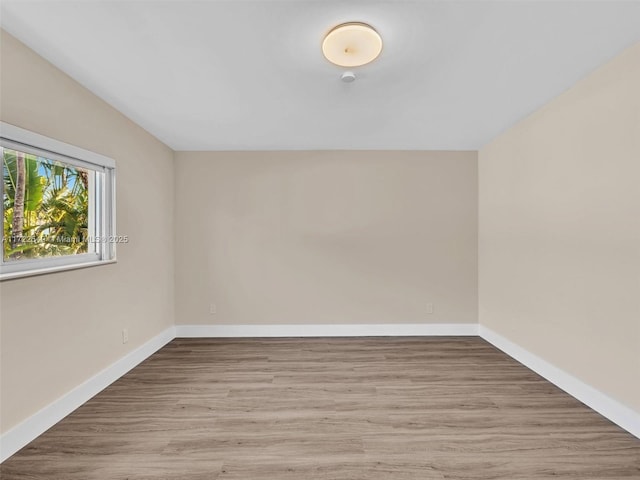 unfurnished room with light hardwood / wood-style flooring