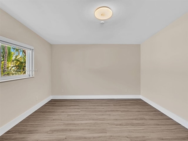 12904 Banyan Rd, North Miami, FL 33181 - spare room featuring wood finished floors and baseboards