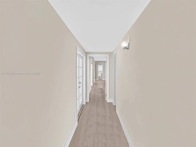 hall with light wood-type flooring