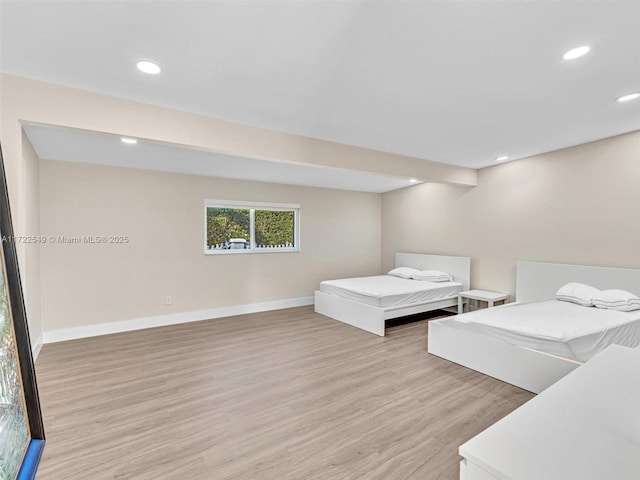 bedroom with light hardwood / wood-style flooring