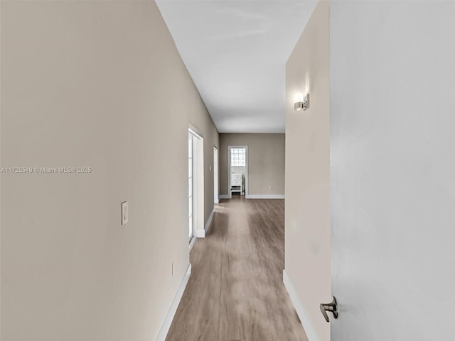 corridor featuring light hardwood / wood-style floors