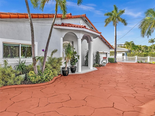 view of patio / terrace featuring a garage