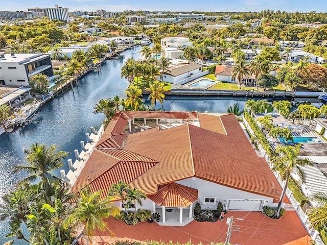 birds eye view of property featuring a water view