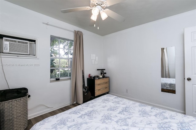 bedroom with a wall mounted air conditioner, hardwood / wood-style floors, and ceiling fan