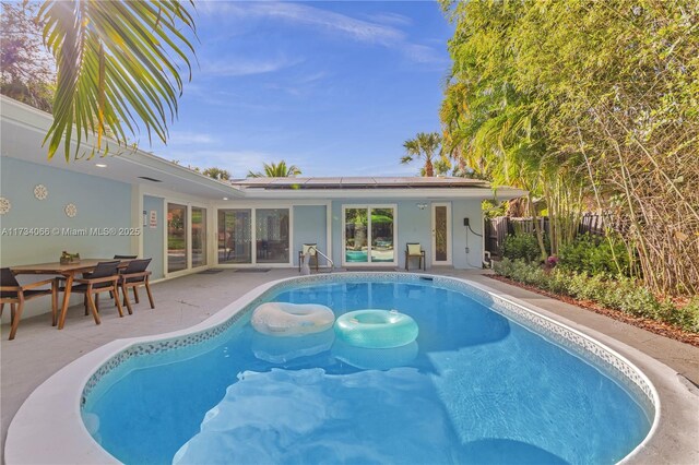 ranch-style home with a front lawn and a carport