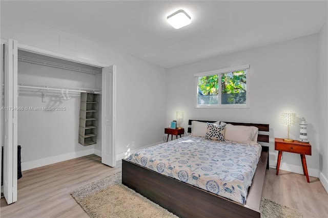 bedroom featuring a closet and light hardwood / wood-style flooring