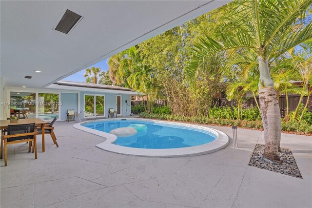 view of pool featuring a patio area