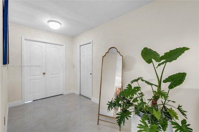 corridor with light tile patterned floors